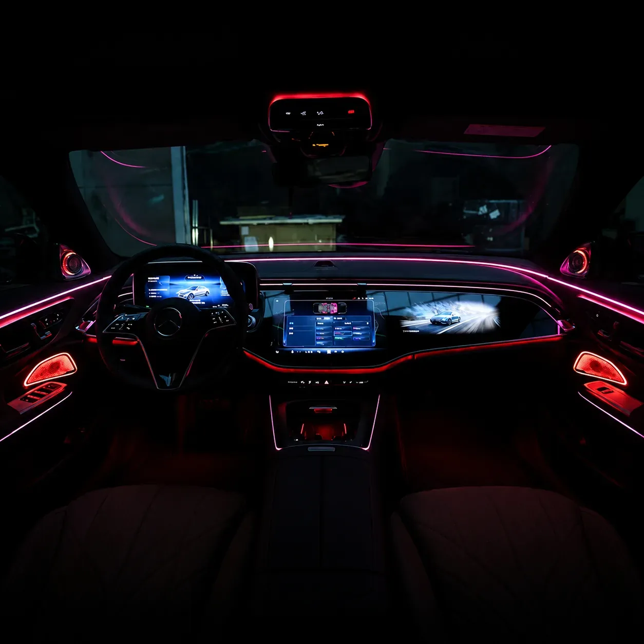 Active ambient lighting displayed across the dashboard and doors of a Mercedes-Benz E-Class W214