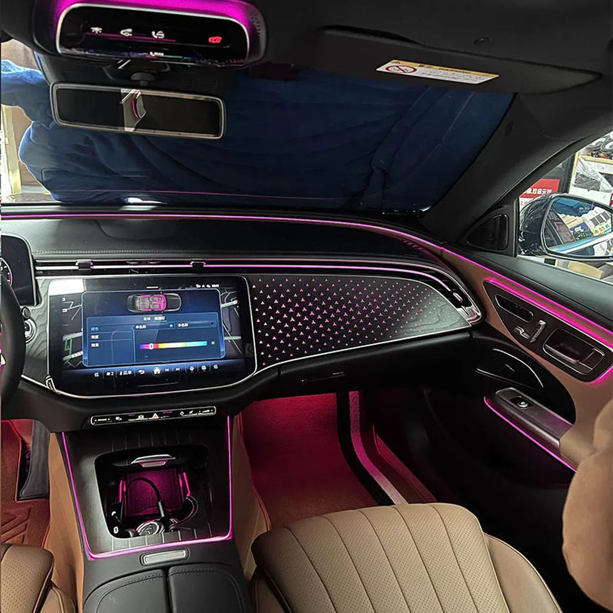 Complete stellar glow dashboard panel illuminated inside a Mercedes-Benz E-Class W214